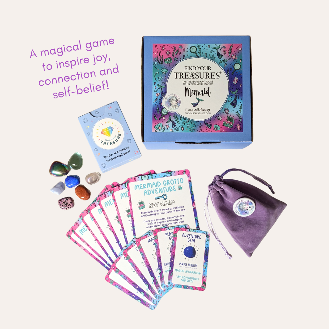Mermaid-themed educational kit and treasure hunt game with Affirmation Cards, gemstones, and a velvet pouch on a white background